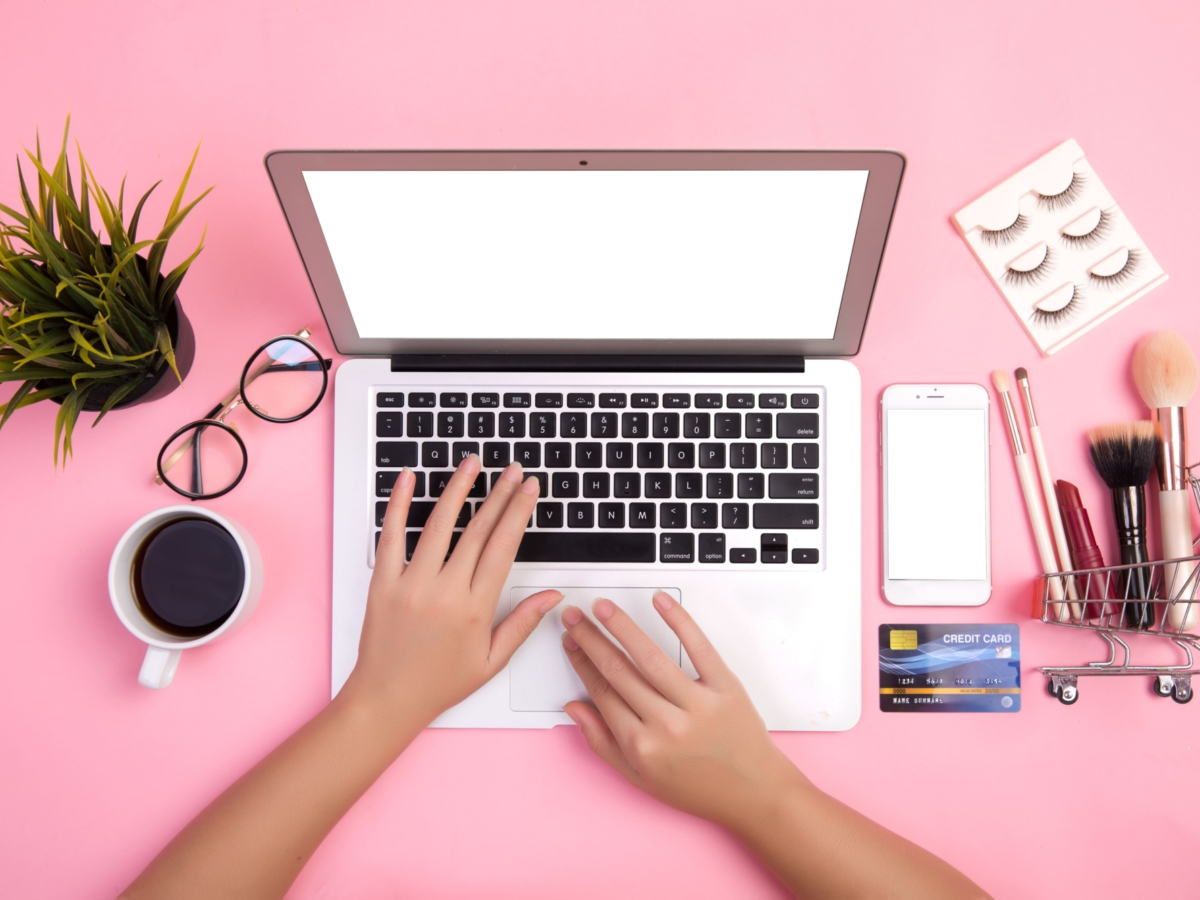 Close up hand typing laptops that have purchased cosmetics using credit card 2 blog article